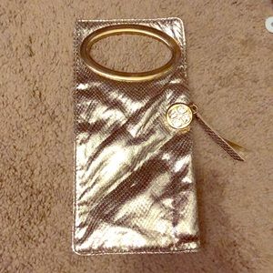 IMAN gold hand bag